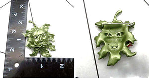 Back and front of greenman pin