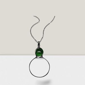 Necklace with magnifying glass