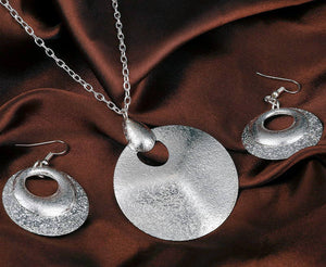 silver necklace and earrings