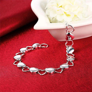 alternating solid and hollow heart bracelet