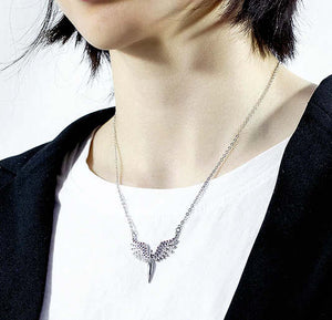 woman wearing angel necklace