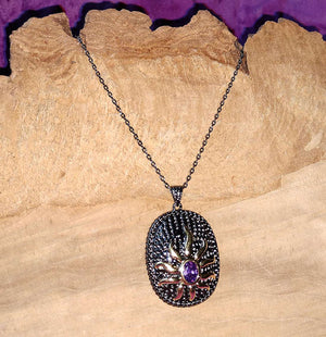 Gold Sun with Purple Center On Black Necklace