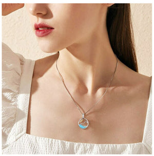 woman wearing ocean necklace